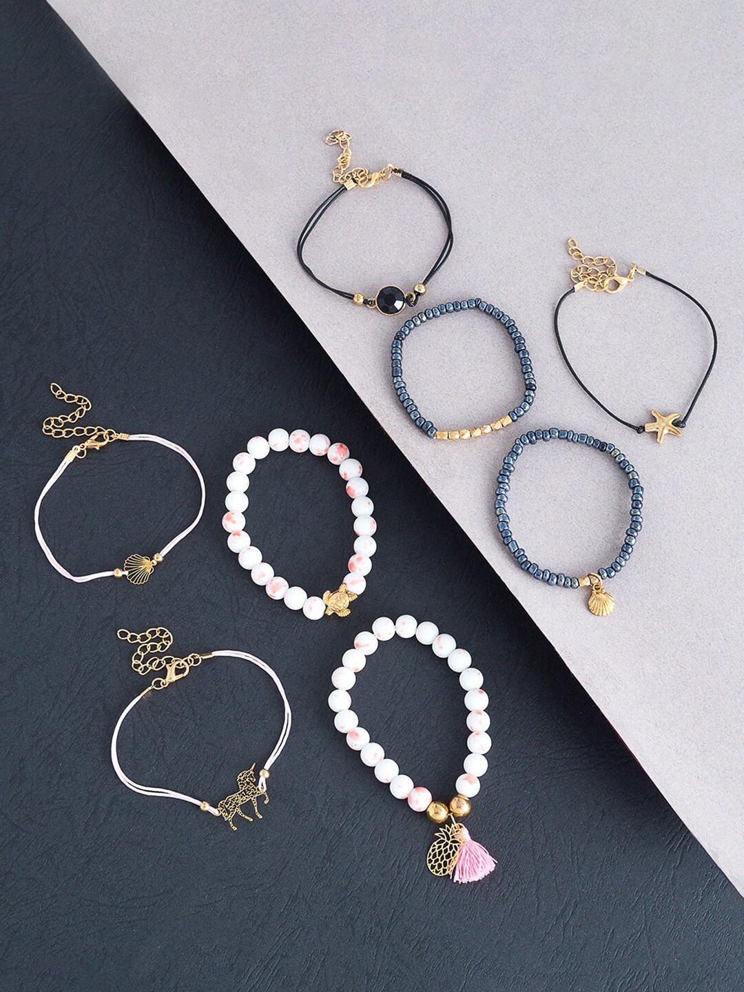 

Golden Peacock Women 8pcs Black & White Bracelet