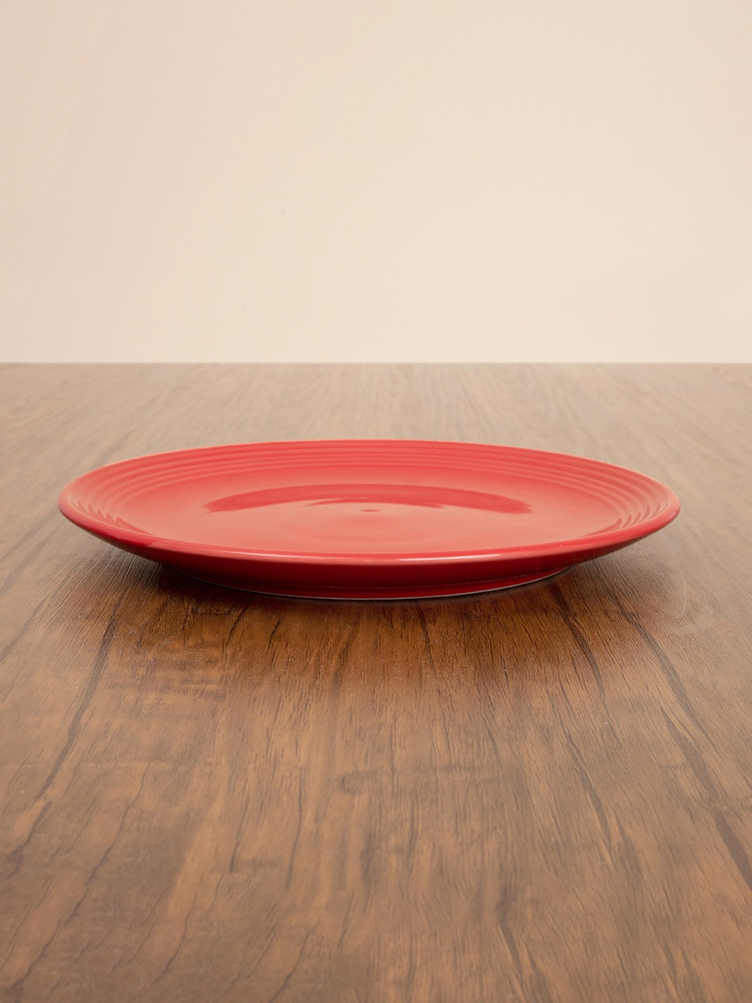 

Home Centre Red & 1 Pieces Stoneware Glossy Plates