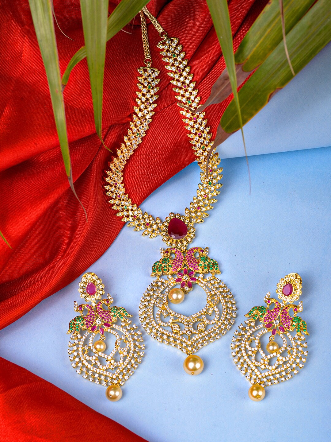 

Saraf RS Jewellery Gold-Plated Green & Pink AD Studded & Beaded Jewellery Set