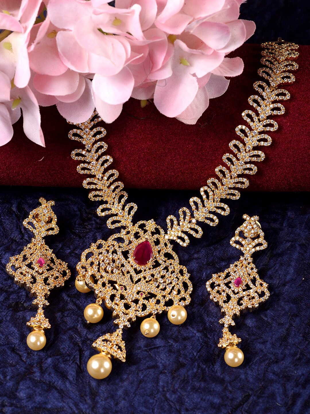 

Saraf RS Jewellery Gold-Plated Pink & White AD-Studded & Pearl Beaded Jewellery Set