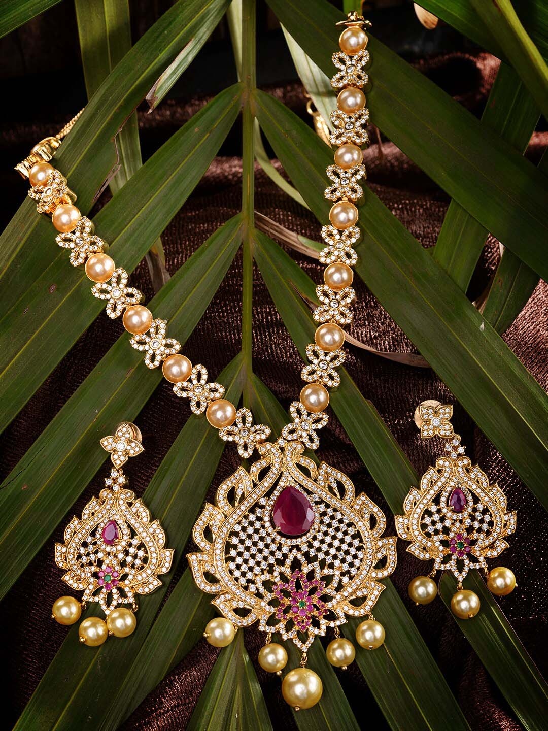 

Saraf RS Jewellery Gold-Plated White & Pink AD Studded & Beaded Jewellery Set