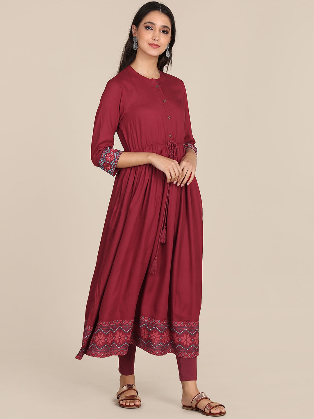 

Karigari Women Red Solid Mandarin Collar Flared Anarkali Kurta