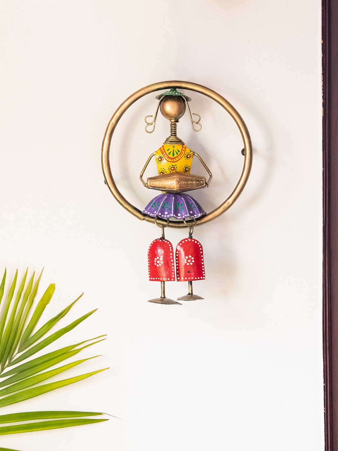 

ExclusiveLane Gold-Toned Yellow Rajasthani Dhol Artist Wall Decor Hanging