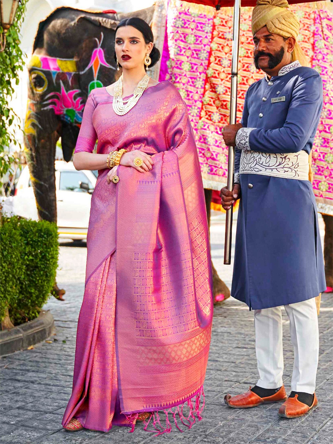 

Mitera Burgundy & Golden Ethnic Motifs Zari Silk Blend Kanjeevaram Saree