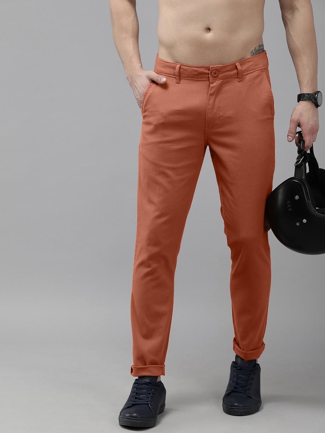 

The Roadster Lifestyle Co. Men Rust Orange Solid Mid Rise Trousers