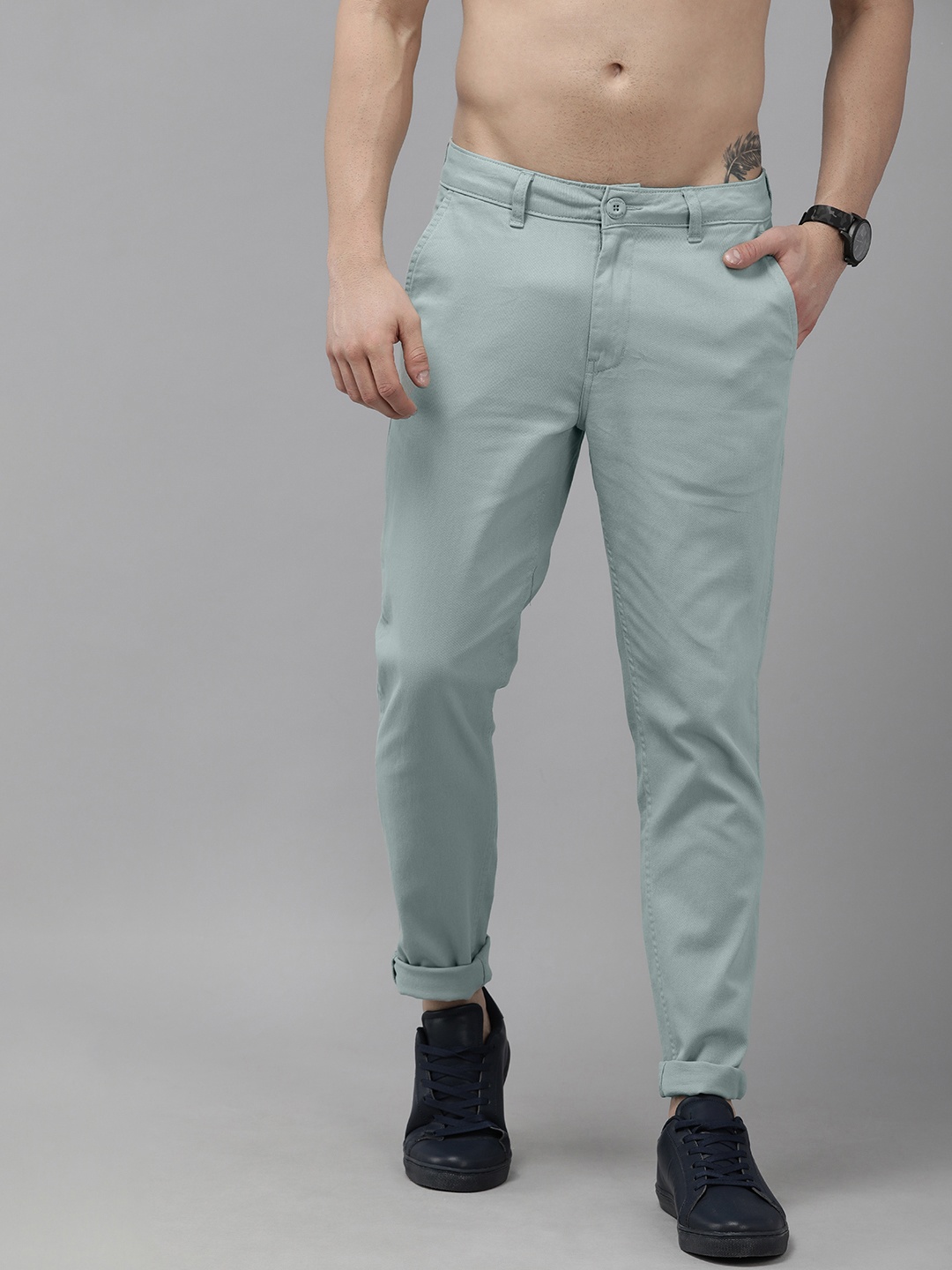 

The Roadster Lifestyle Co. Men Green Solid Mid Rise Trousers