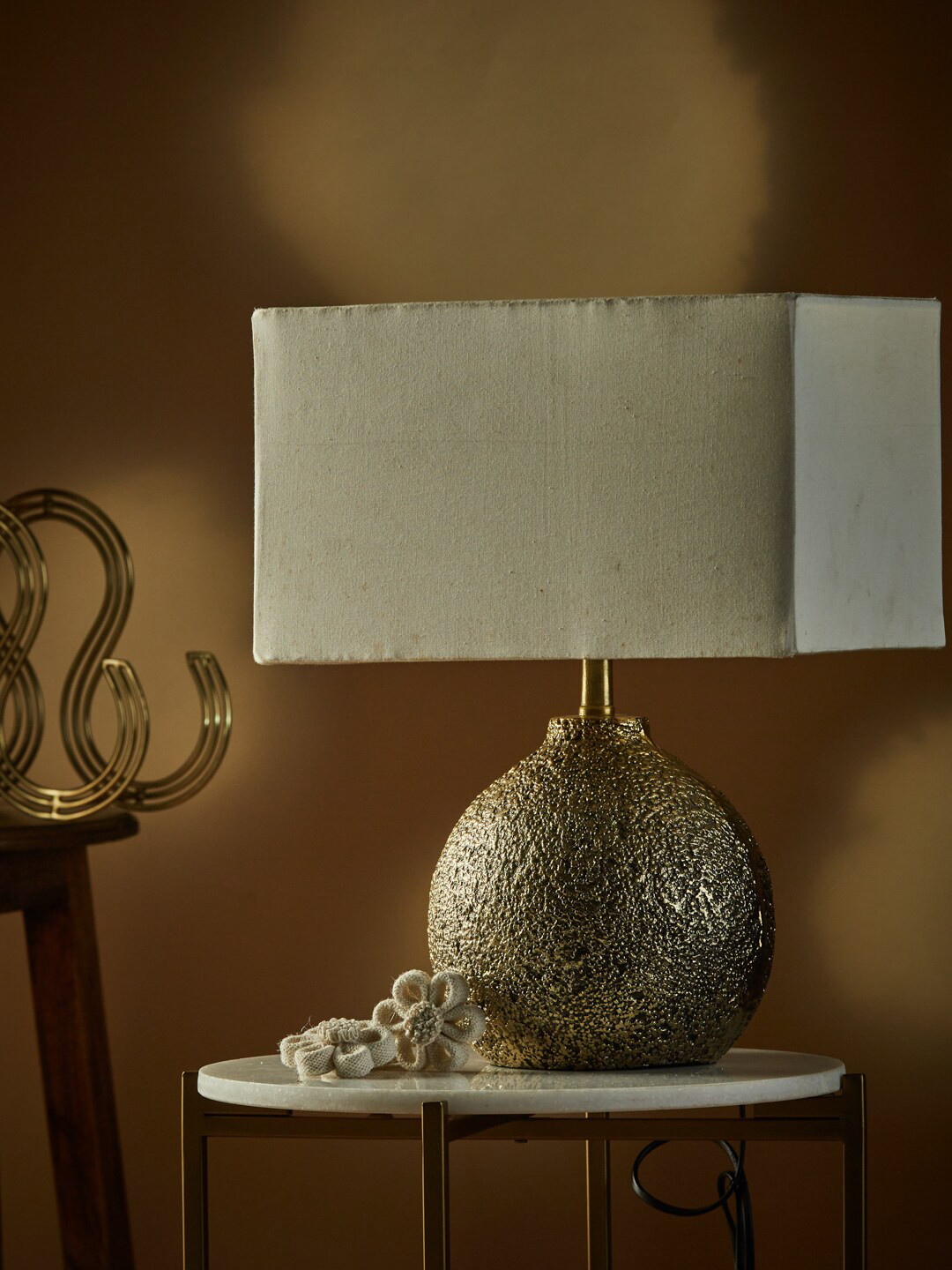 

Fabindia Gold-Toned Shivesh Textured Round Lamp