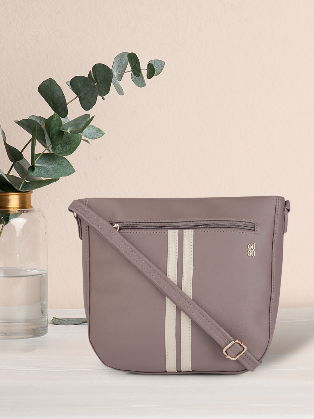 

Baggit Mauve Pink Solid Regular Structured Shoulder Bag with Applique Detail