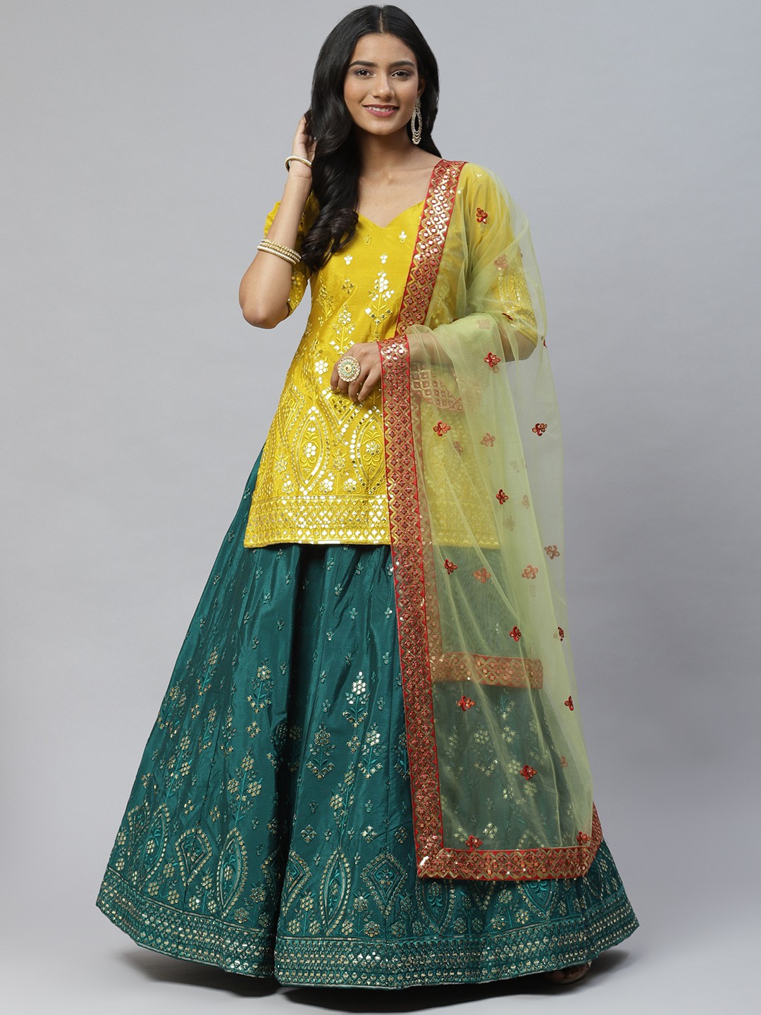 

SHUBHKALA Green & Yellow Embroidered Mirror Work Semi-Stitched Lehenga & Unstitched Blouse With Dupatta