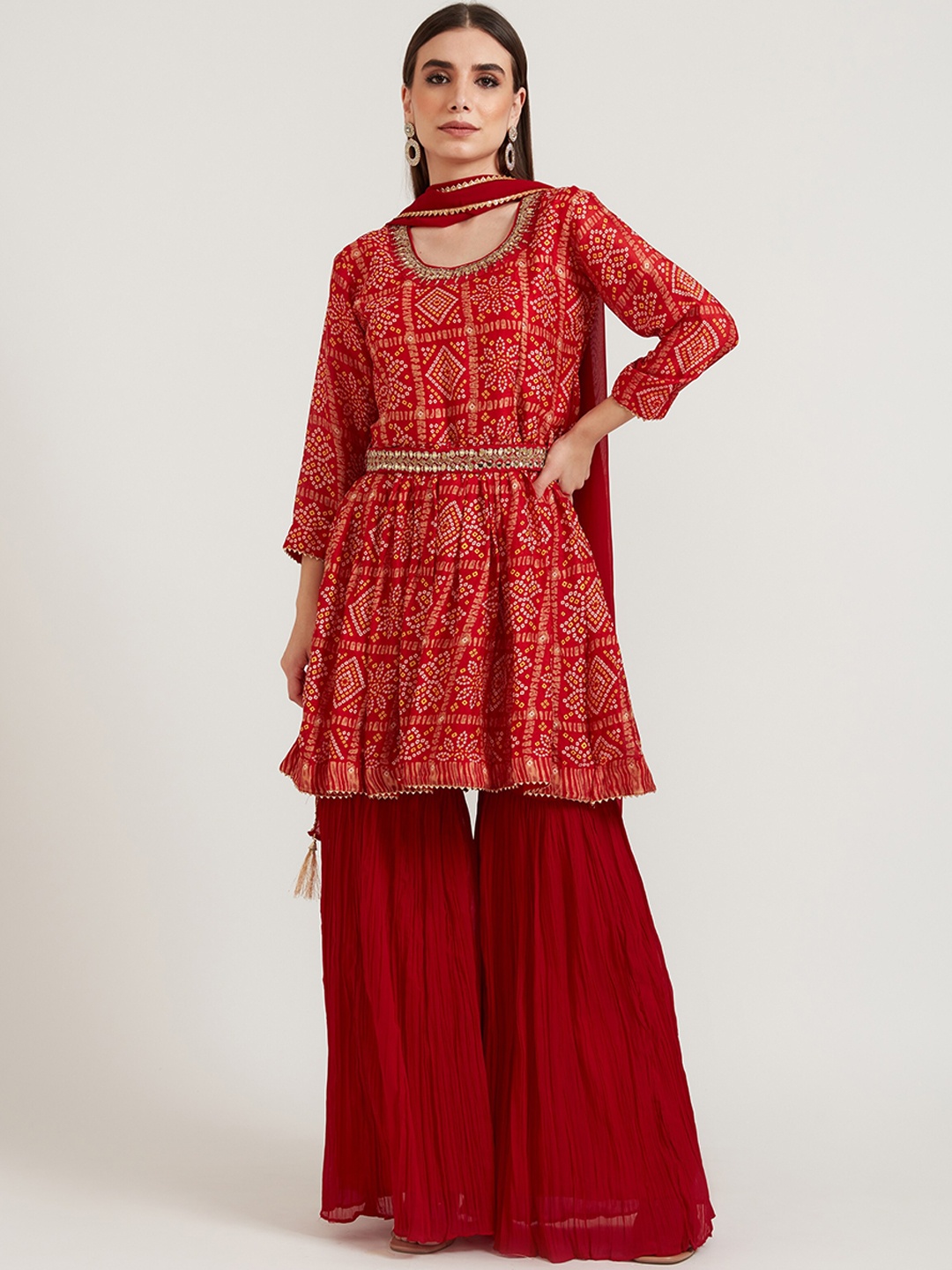 

Neerus Women Red Bandhani Printed Pleated Mirror Work Kurta with Sharara & With Dupatta