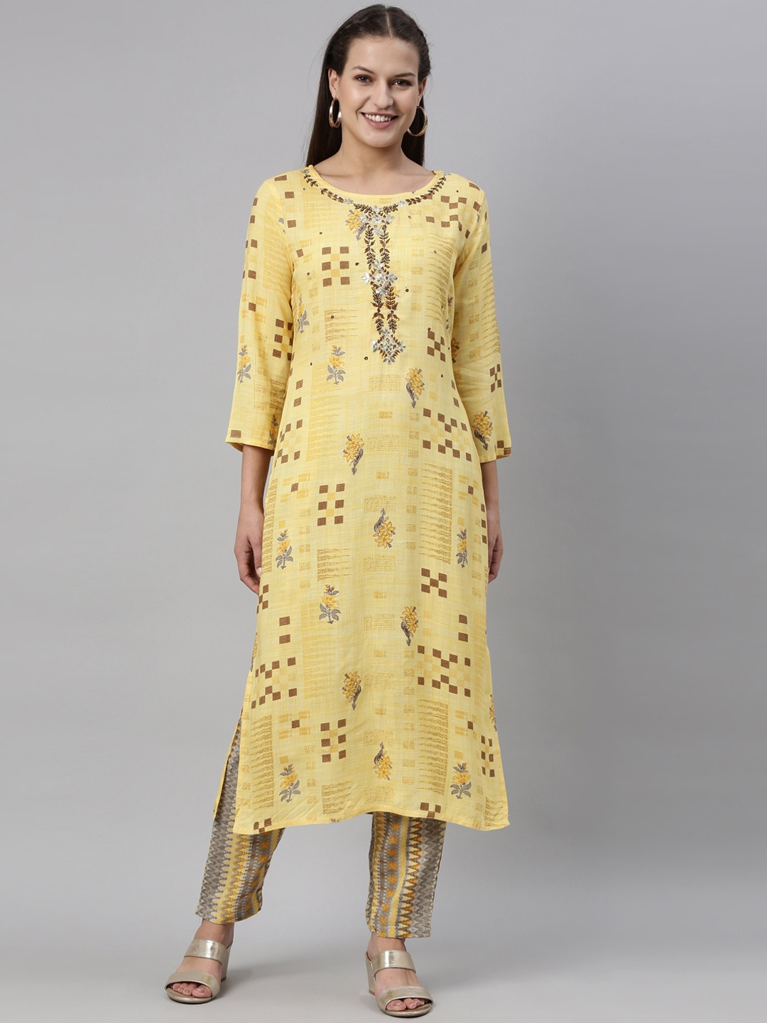 

Neerus Women Yellow Floral Embroidered Layered Kurti with Trousers