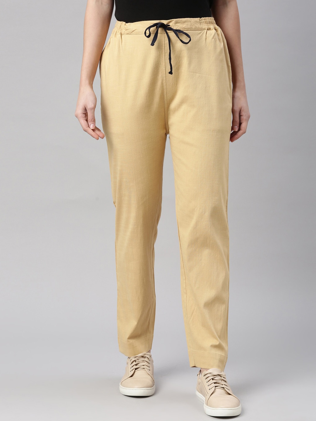 

Kryptic Women Beige Solid Slim Fit Trousers