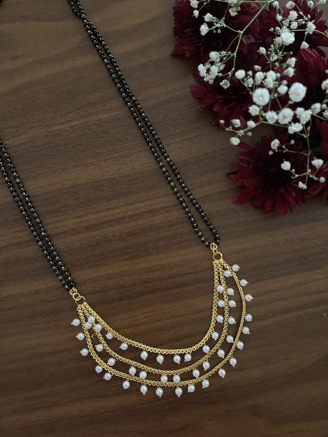 

Digital Dress Room Gold-Plated 3 Layers With White Moti Black Beads Chain Mangalsutra