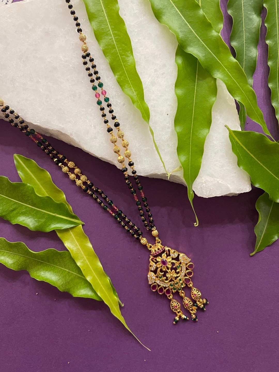 

Digital Dress Room Women Gold-Plated Black Beaded Pink & Green AD Studded Mangalsutra