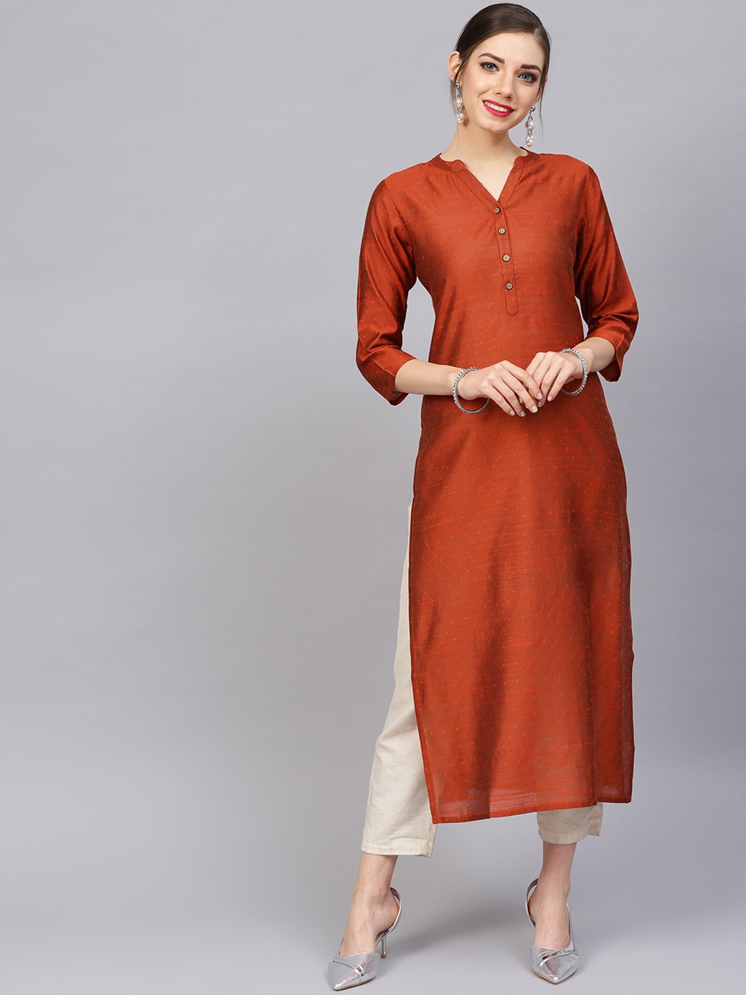 

Varanga Women Rust Solid Dobby Kurta