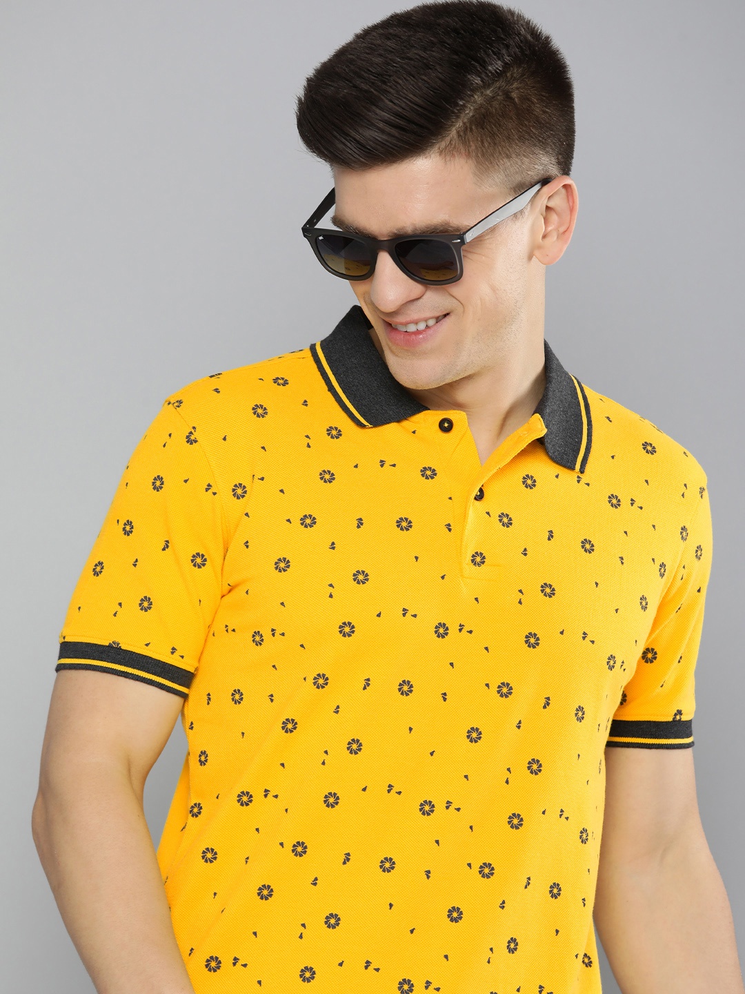 

Mast & Harbour Men Mustard Yellow & Navy Blue Floral Printed Polo Collar T-shirt