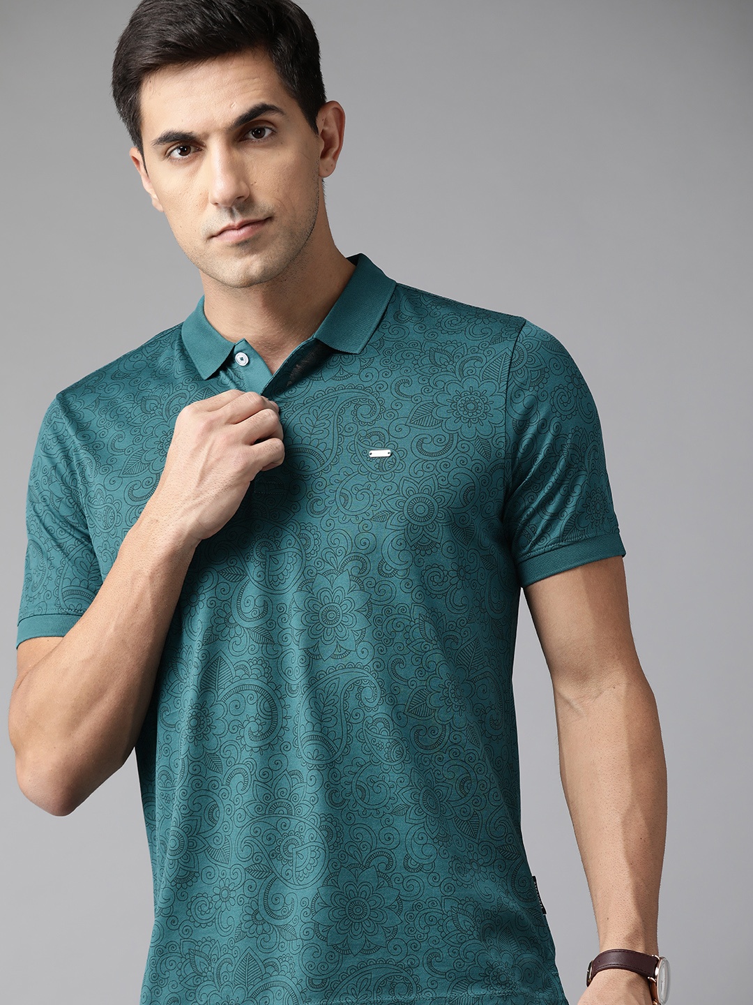 

Van Heusen Men Teal & White Floral Printed Polo Collar Pure Cotton T-shirt