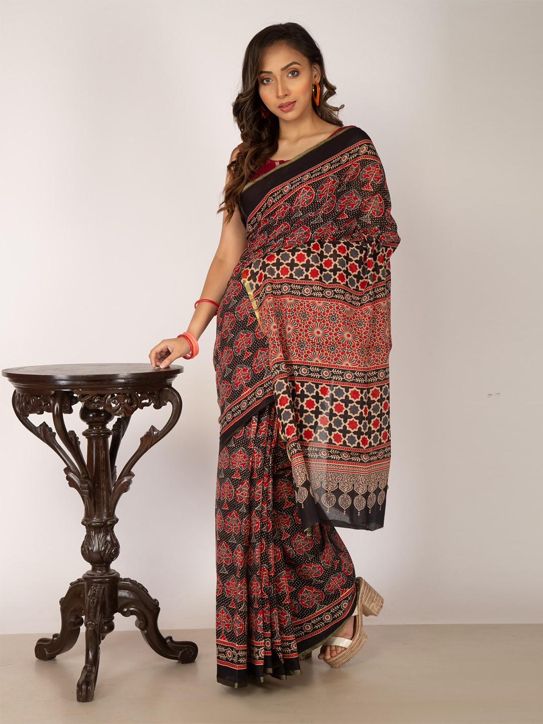 

Unnati Silks Black & Red Ajrak Printed Pure Cotton Patola Saree