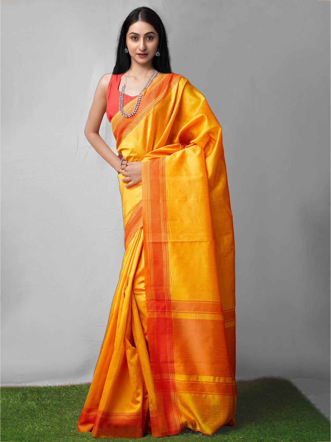 

Unnati Silks Yellow & Orange Ethnic Motifs Silk Cotton Mysore Silk Saree
