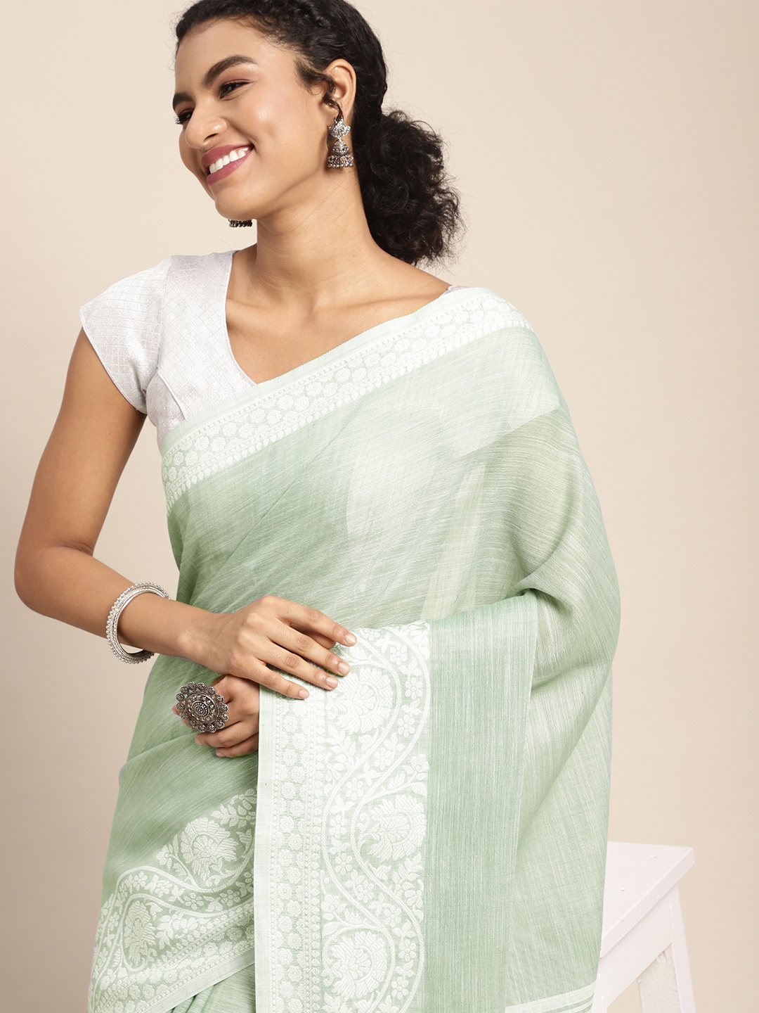 

Mitera Green & White Ethnic Motifs Woven Design Pure Linen Saree