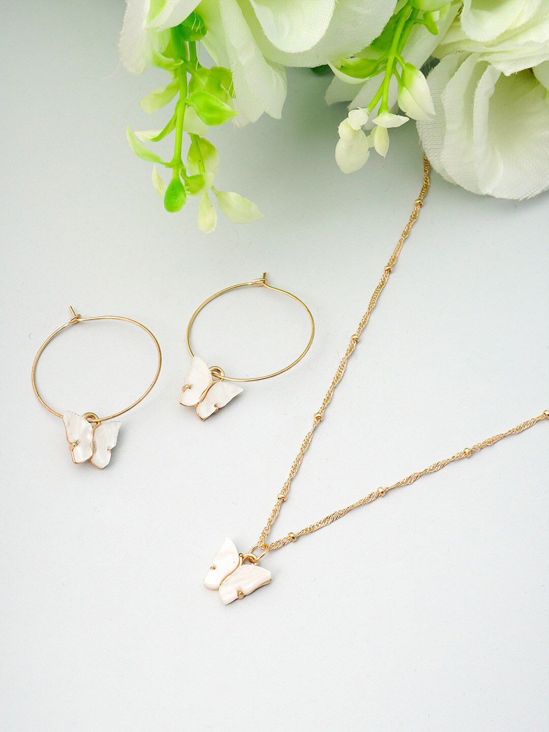 

Ferosh Gold-Toned White Stone Studded Butterfly Shaped Jewellery Set