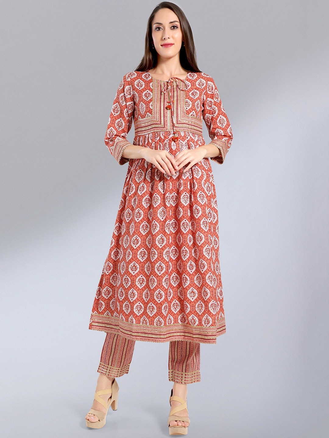 

MADHURAM Women Orange Ethnic Motifs Printed Kurta with Churidar & With Dupatta