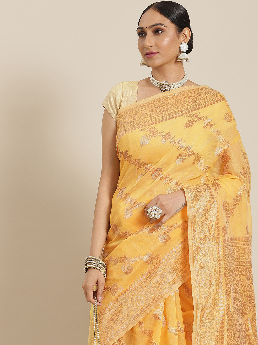 

Mitera Yellow & Golden Ethnic Motifs Zari Cotton Blend Banarasi Saree