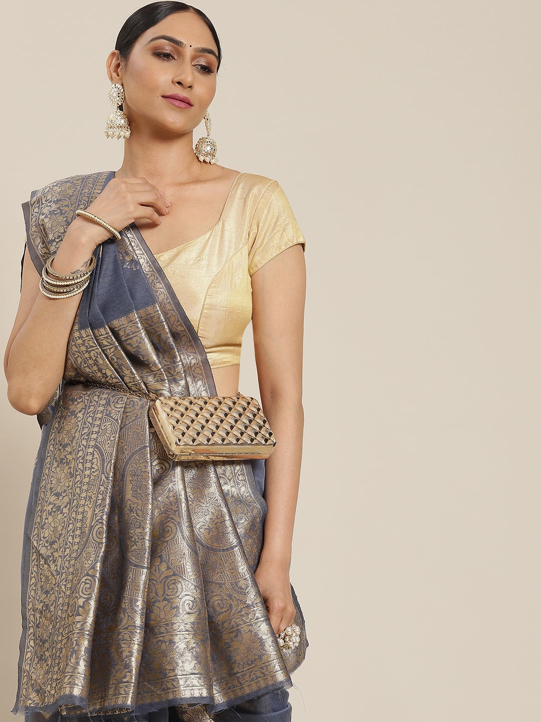

Mitera Grey & Golden Ethnic Motifs Zari Cotton Blend Banarasi Saree