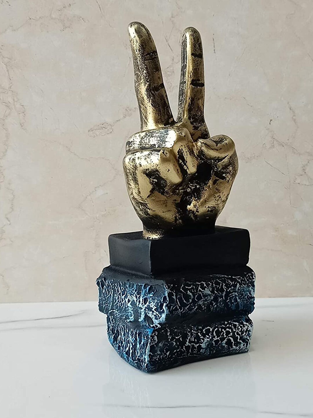 

CraftVatika Gold Toned & Blue Victory Sign Hand Gesture Showpiece