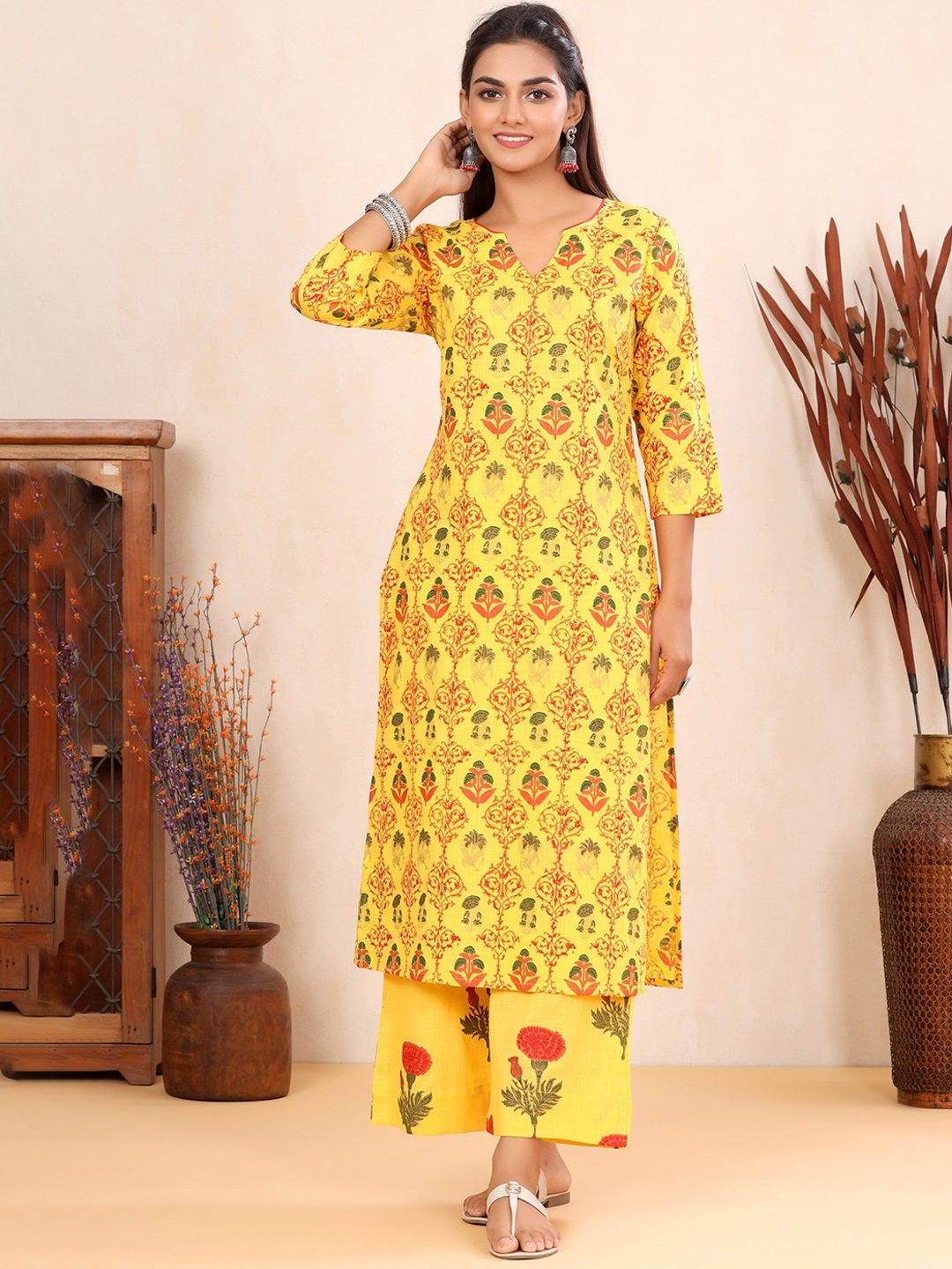 

mirari Women Yellow Floral Printed Kurta And Palazzo Set