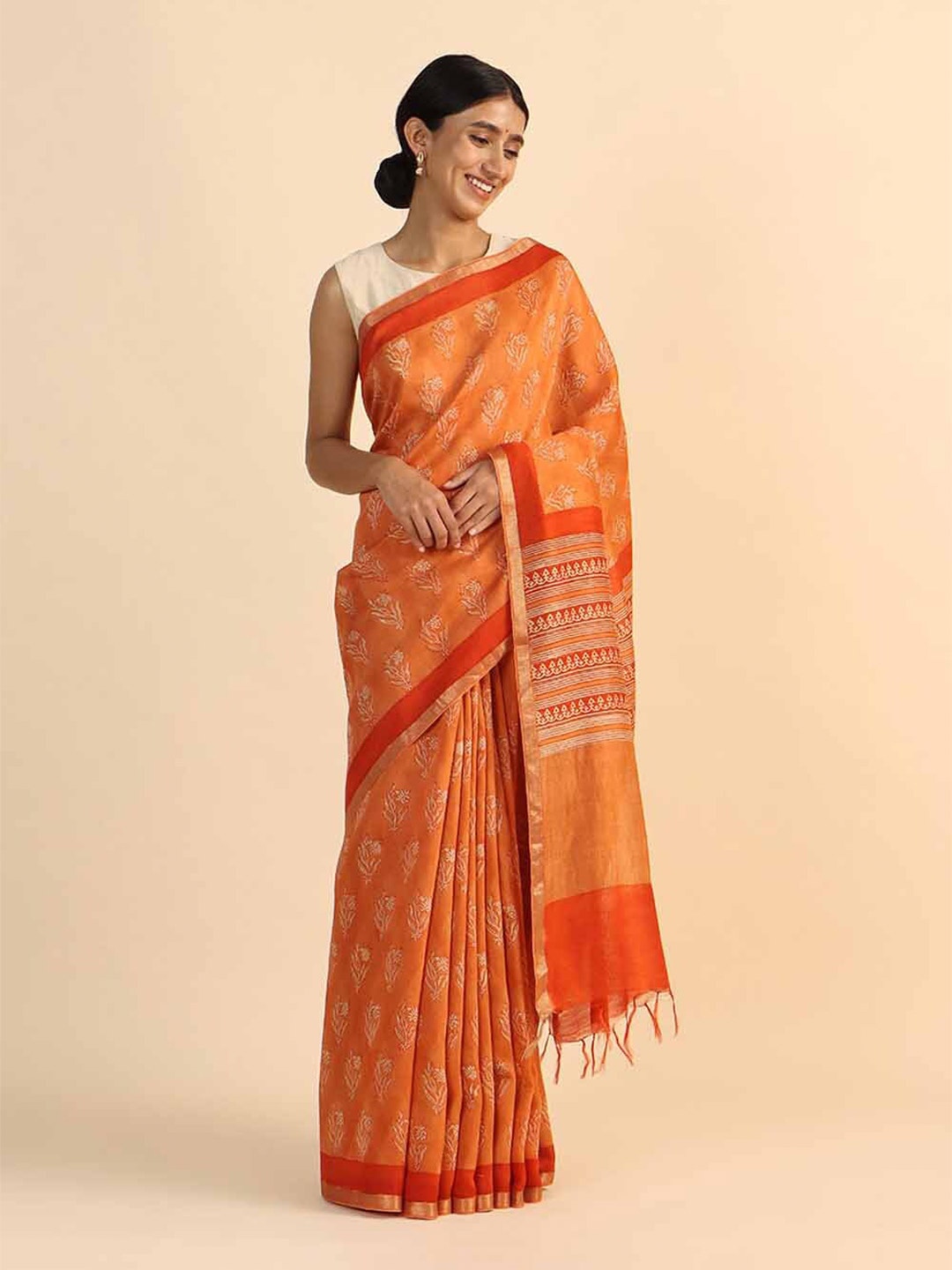 

Taneira Orange Floral Pure Silk Tussar Saree