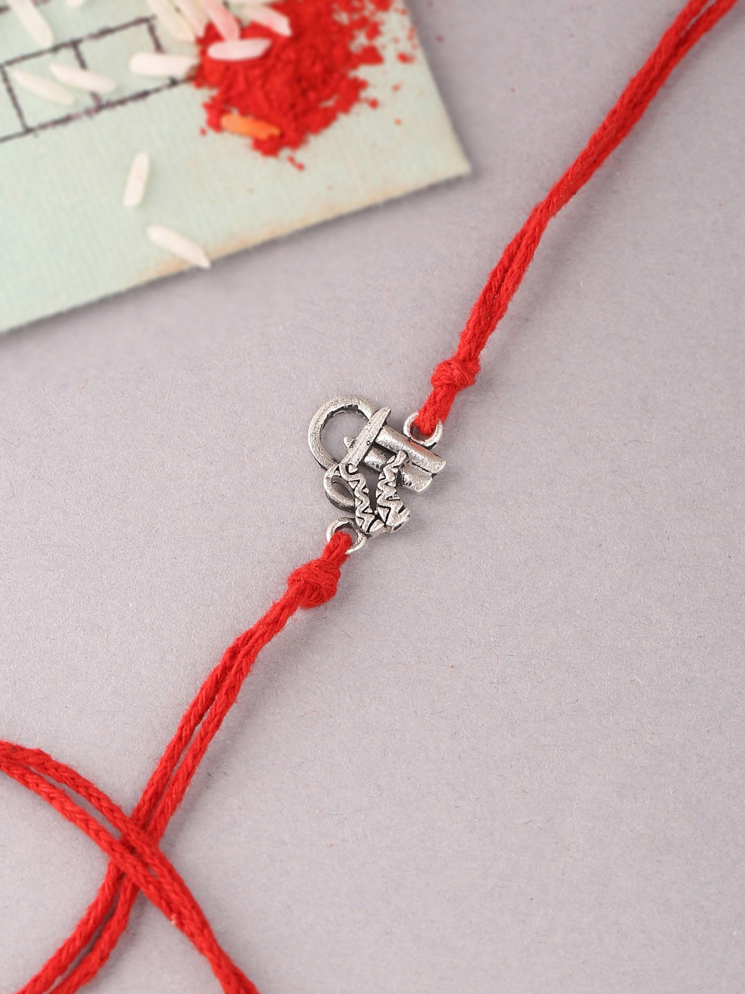 

ADORN by Nikita Ladiwala 92.5 Sterling Silver Rakhi With Roli Chawal