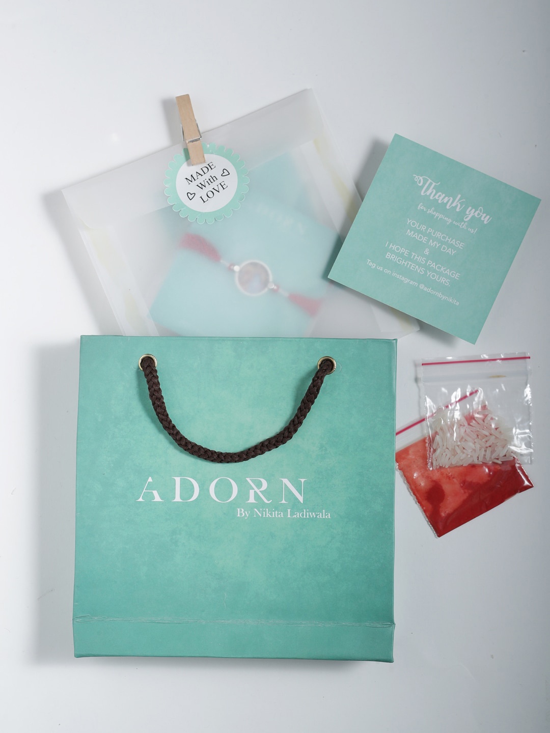 

ADORN by Nikita Ladiwala 925 Sterling Silver Red Rakhi