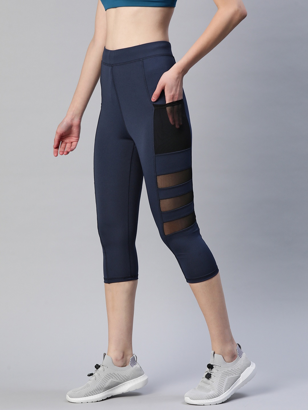 

Blinkin Women Navy Blue Three-Fourth Rapid Dry Tights With Mesh Panels & Side Pockets
