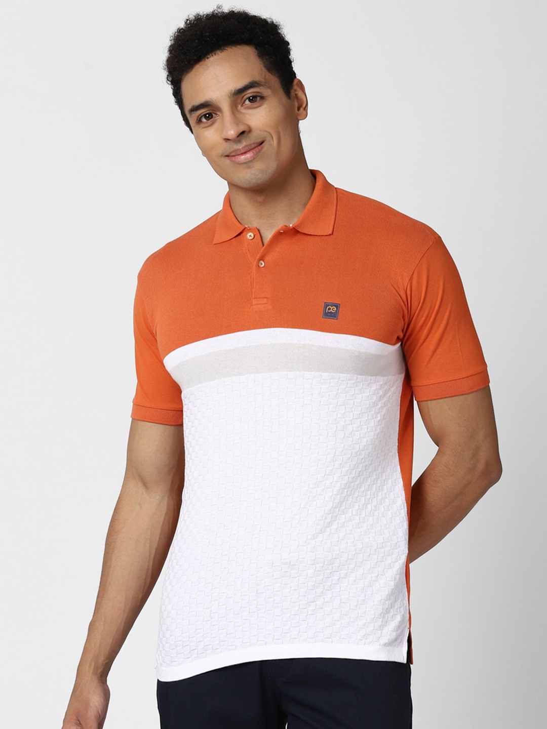 

Peter England Casuals Men White & Orange Colourblocked Polo Collar Slim Fit T-shirt