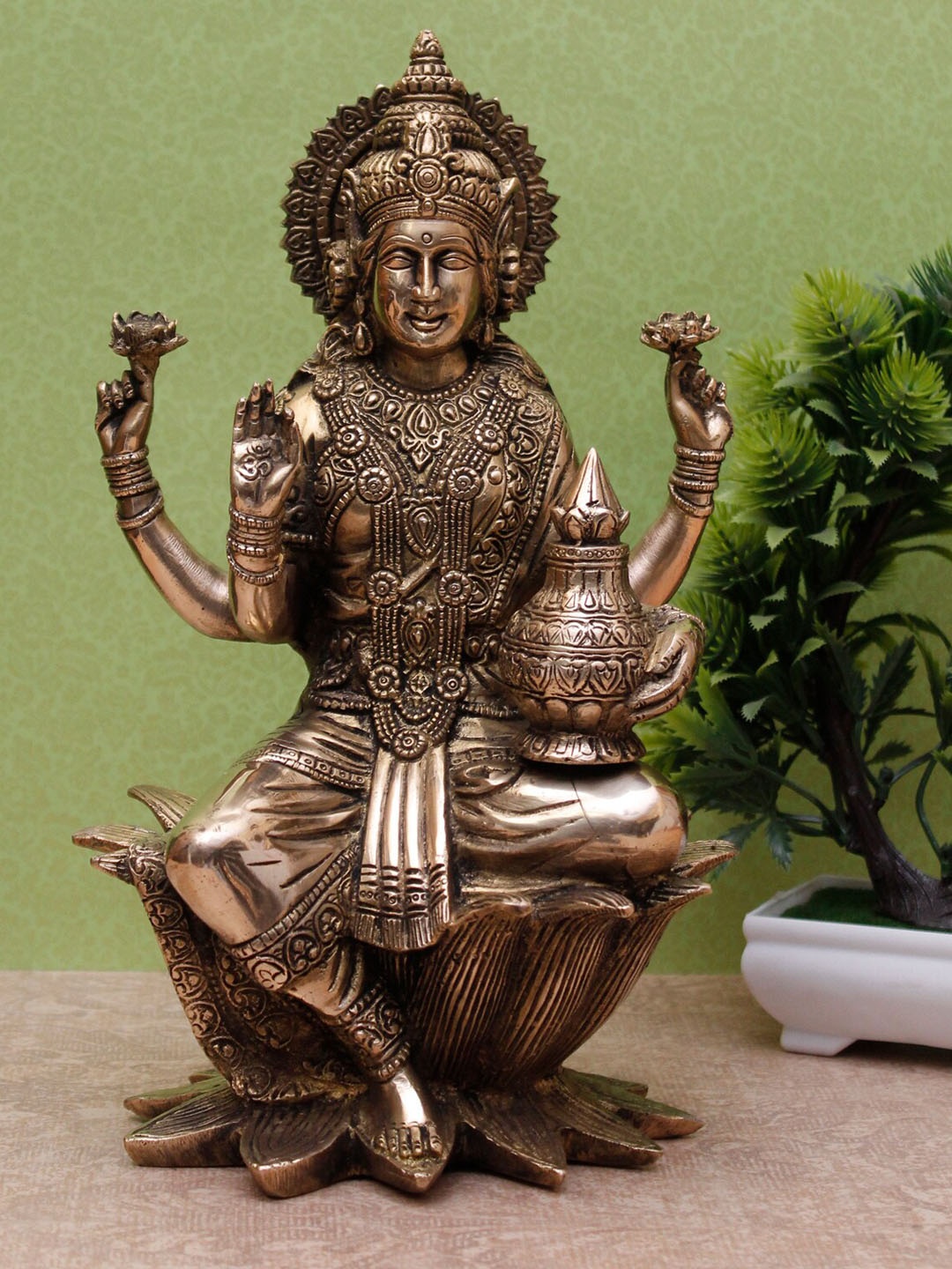 

StatueStudio Gold-Toned Antique Lakshmi Idol With Money Pot Showpiece