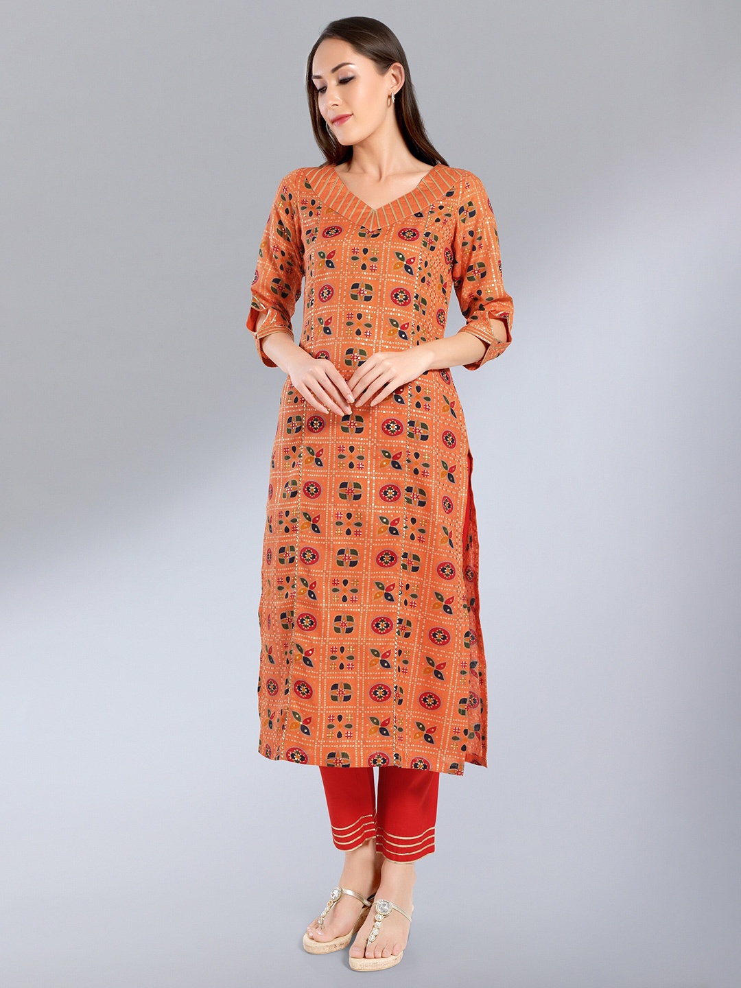

MADHURAM Orange Geometric Printed V-Neck Kurti