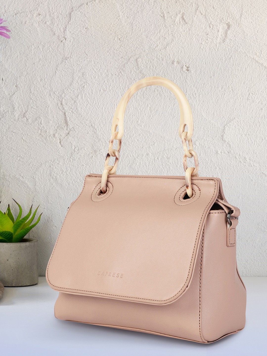 

Caprese Women Pink Solid Structured Satchel