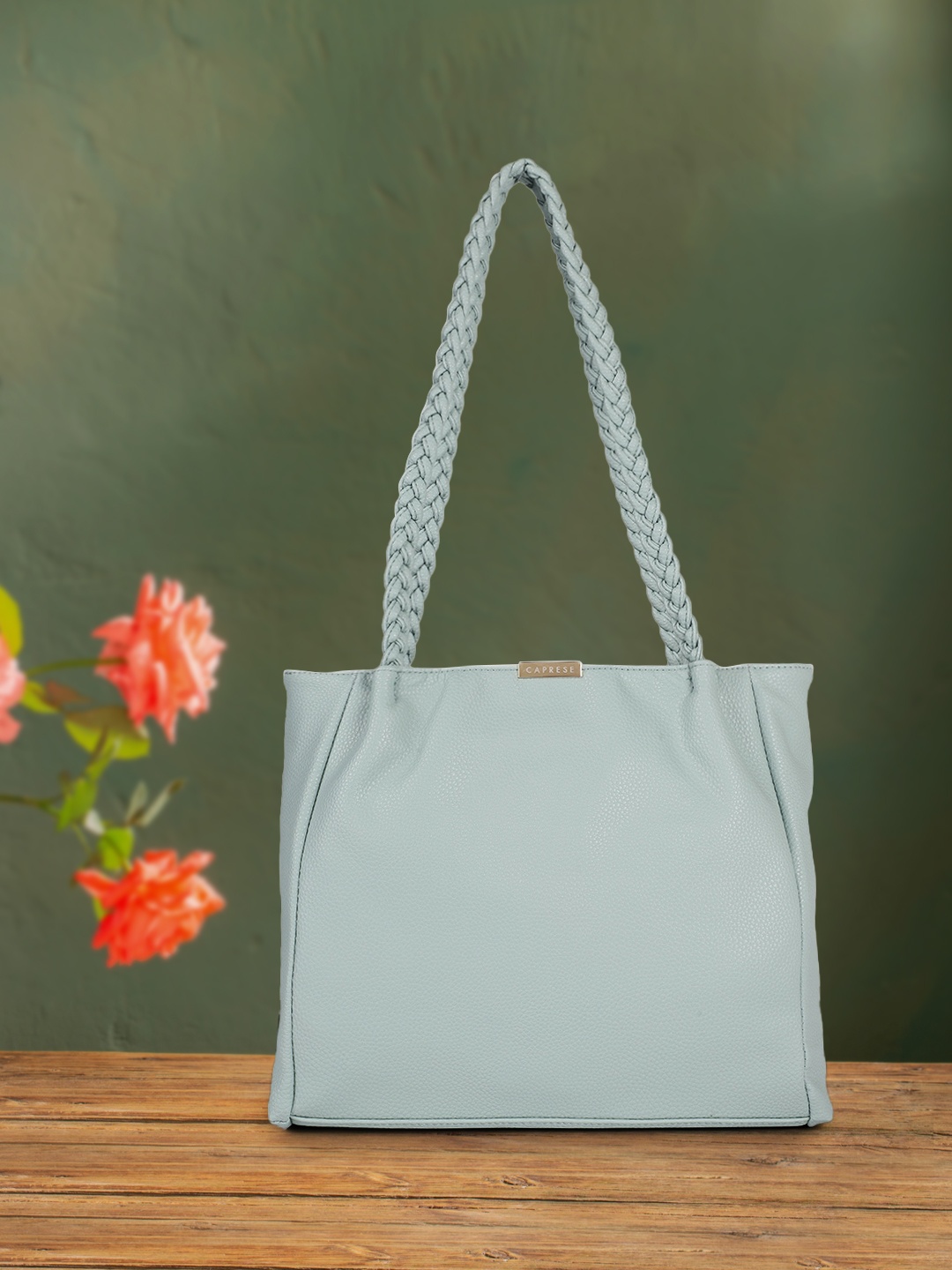 

Caprese Women Blue Solid Structured Shoulder Bag