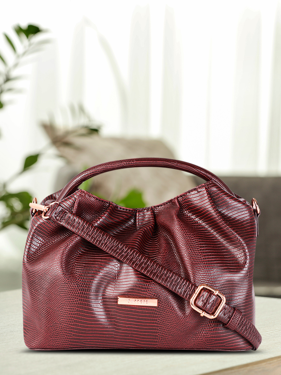 

Caprese Burgundy Animal Textured Structured Handheld Bag