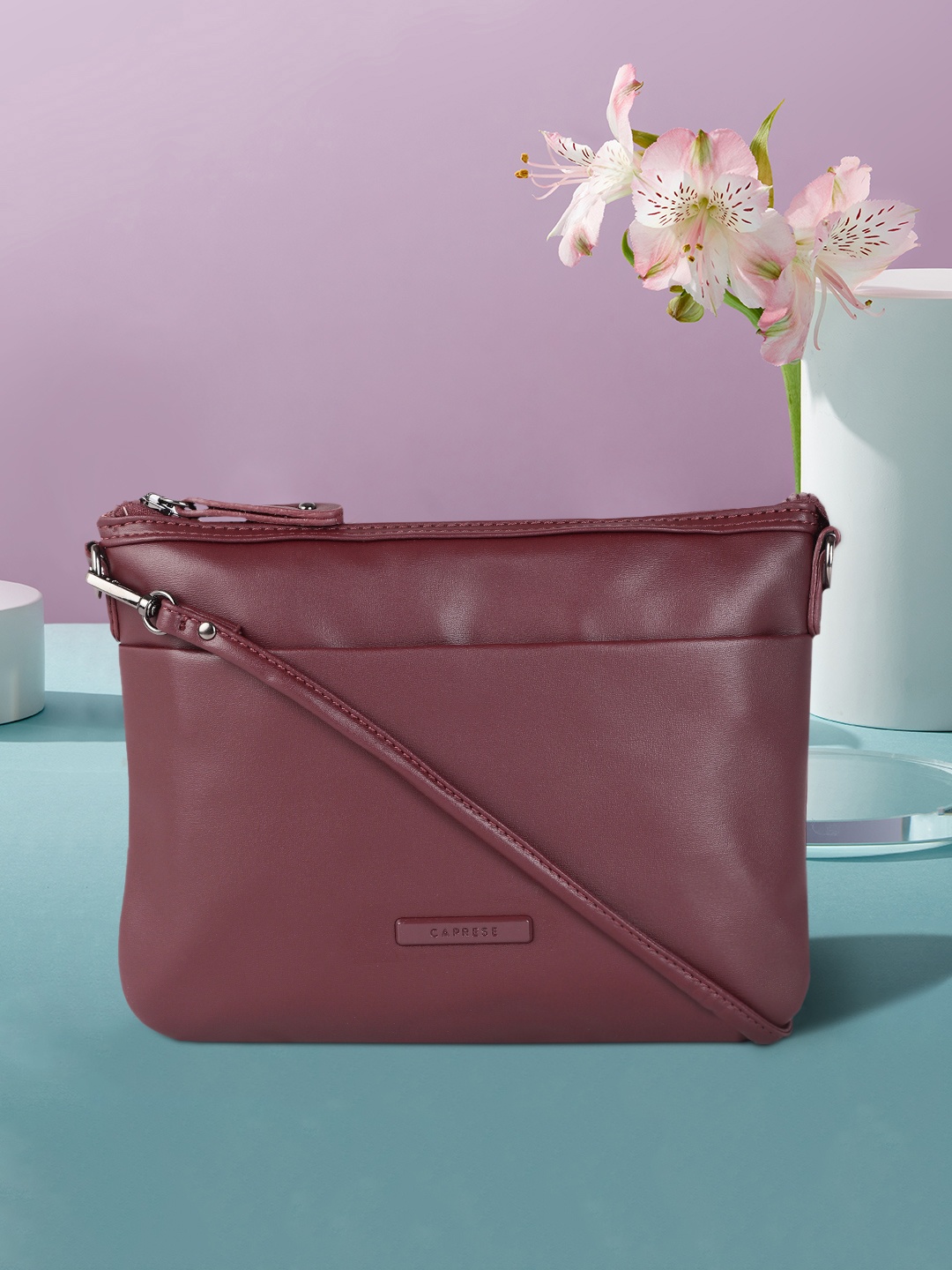 

Caprese Maroon Structured Sling Bag