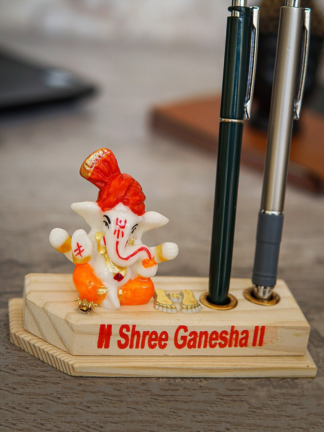 

StatueStudio Beige Textured Ganesha Statue On Wooden Base With Pen Holder Showpiece