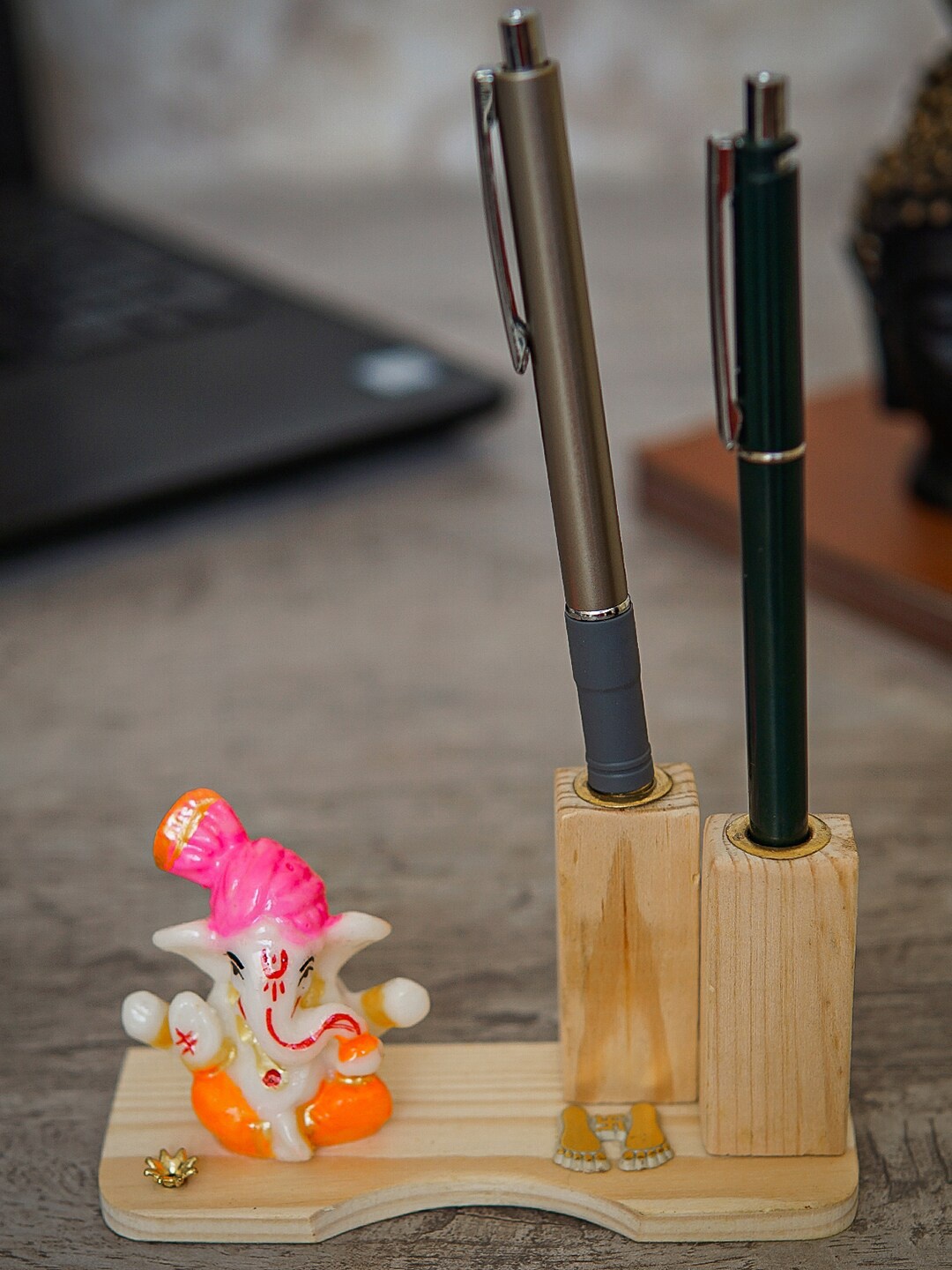 

StatueStudio Beige Ganesha Statue On Wooden Base With Pen Holder Showpiece