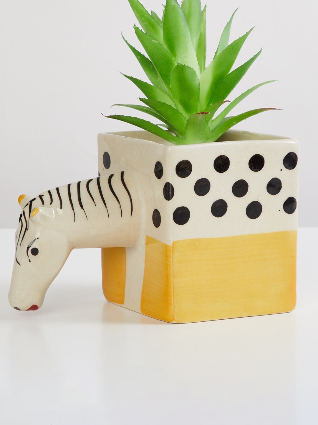 

Home Centre Off-White & Yellow Printed Zebra Square Ceramic Planter