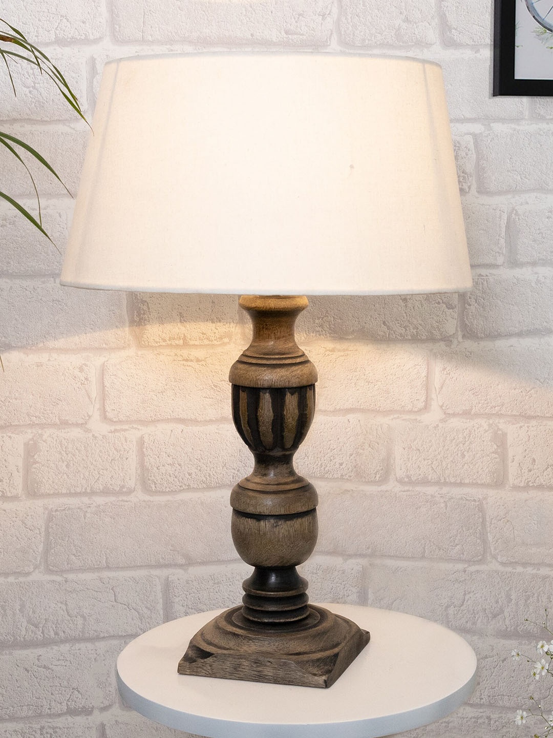 

Homesake Rustic Antique Black French Trophy Carved Table lamp with Empire Khadi Shade