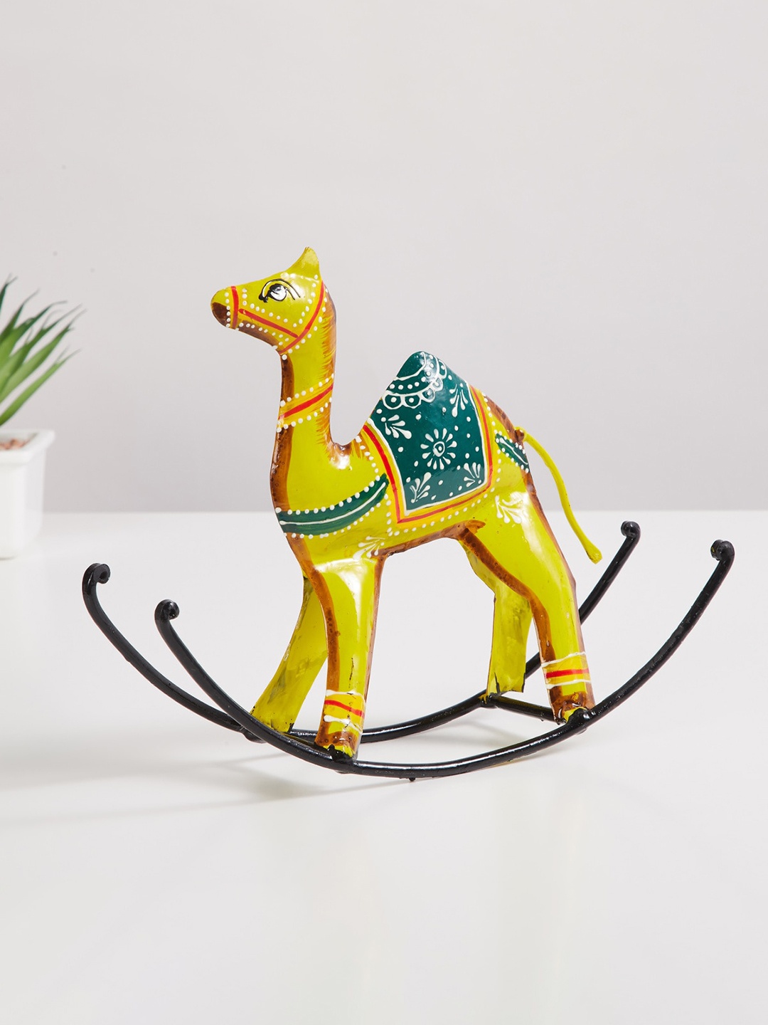 

Home Centre Yellow & Green Camel Rocking Figurine Showpieces