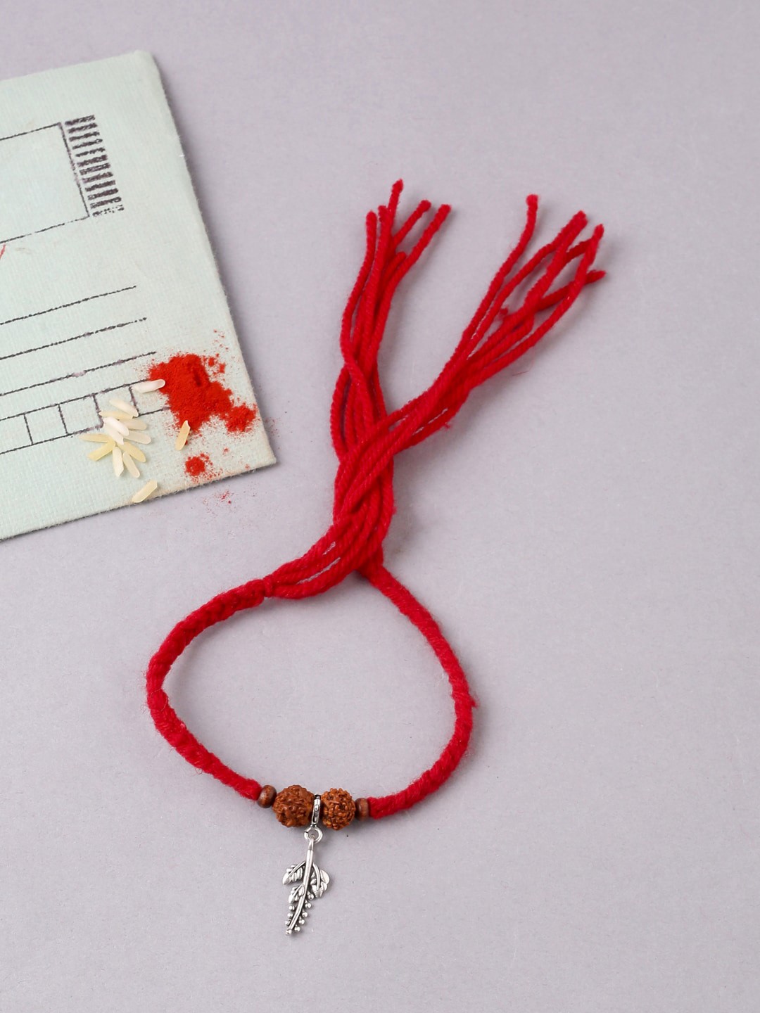 

ADORN by Nikita Ladiwala Unisex Silver-Plated & Red Rudraksha Beaded Rakhi