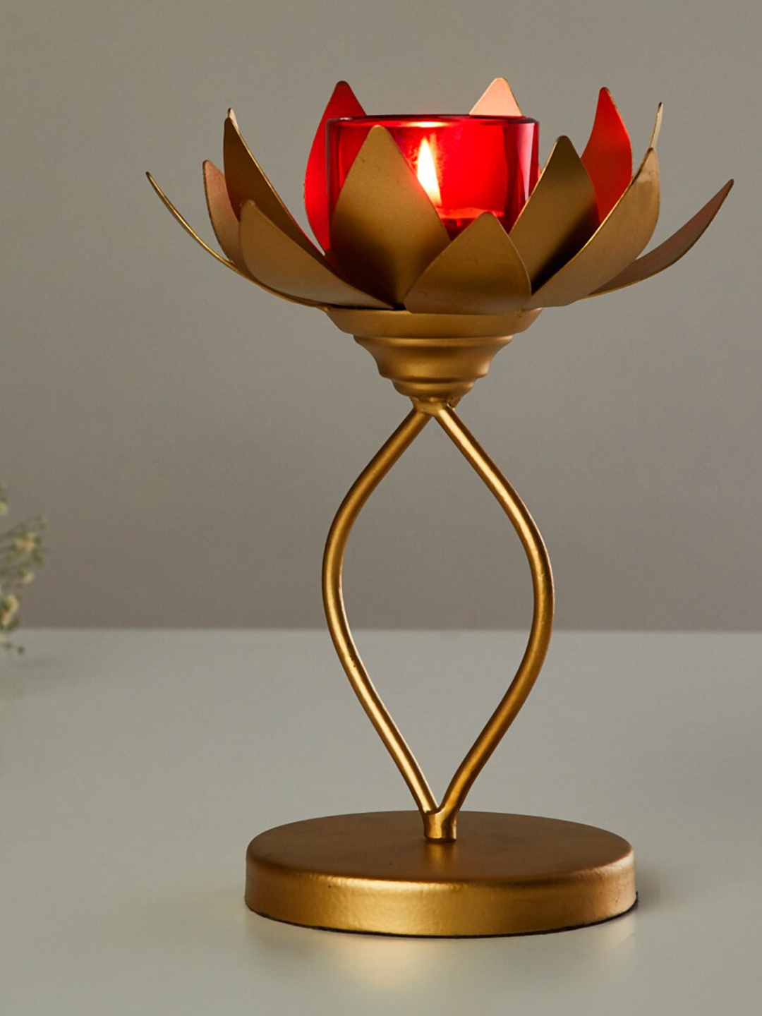 

Home Centre Red & Gold-Toned Solid Lotus Candle Holder