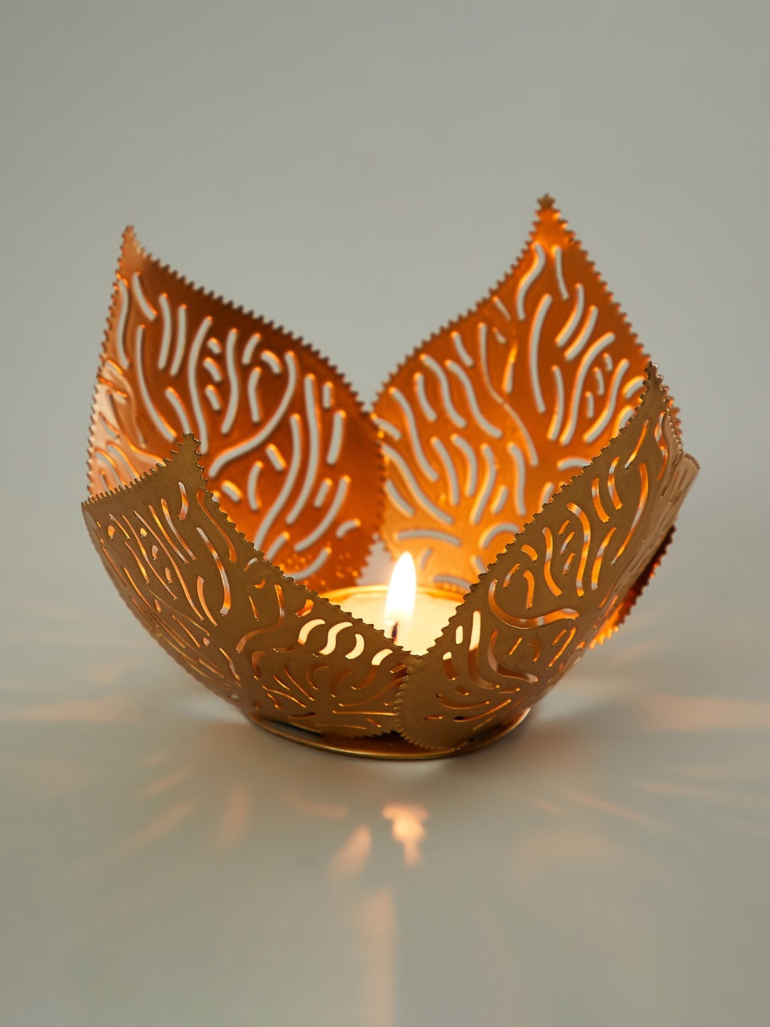 

Home Centre Gold-Toned Textured Candle Holder