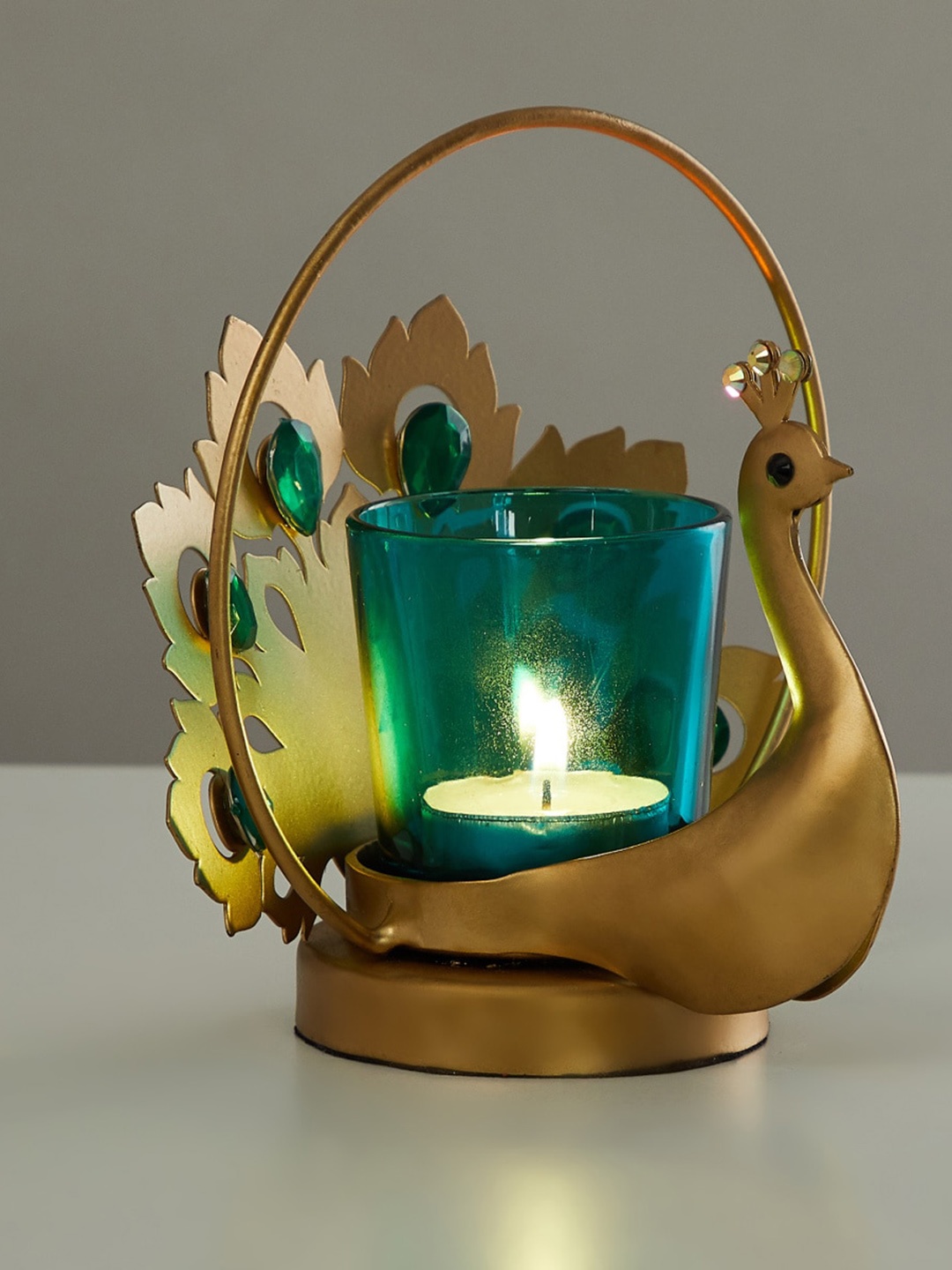 

Home Centre Gold-Toned & Blue Solid Small Peacock Glass Tealight Holder